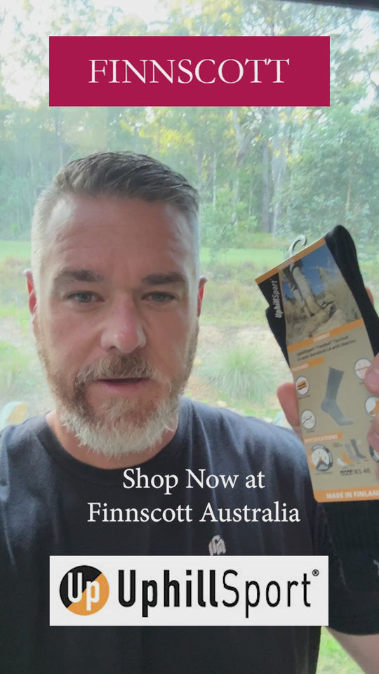 Arctic Combat Socks being held by man in video.